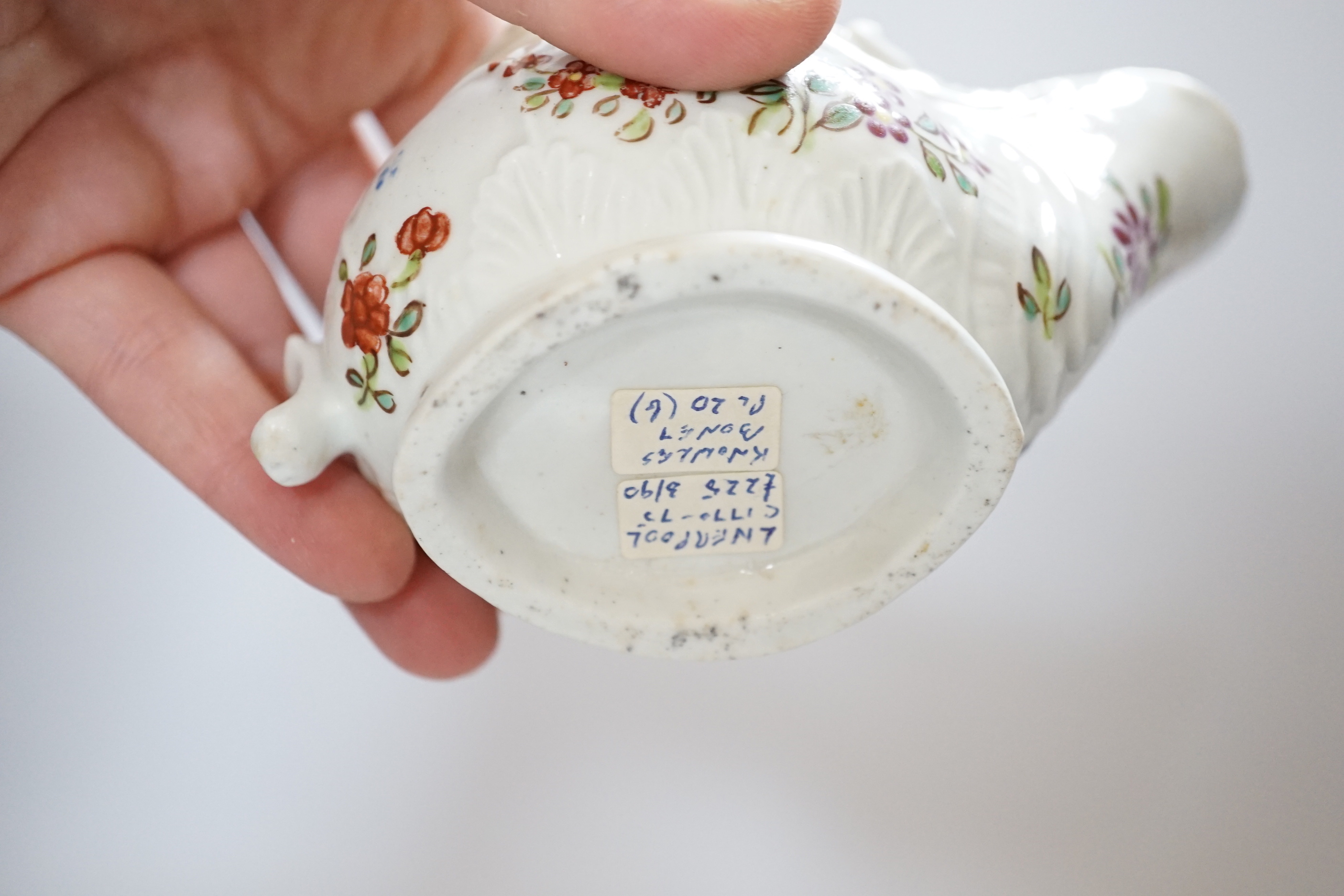 A Chaffers Liverpool saucer, c.1760 and two 18th century Christian or Pennington sauceboats, saucer 12cm diameter